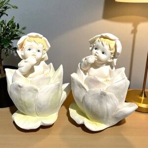 Set of 2 resin figurines, baby/elf/fairy in a flower, no chips or cracks